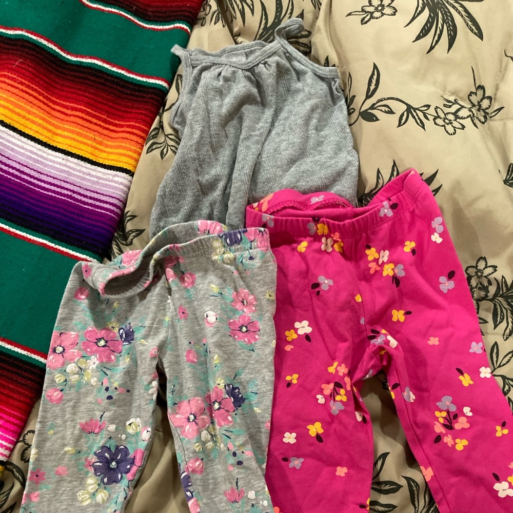 Two pairs floral 18 month pants. 1 tank top onesie